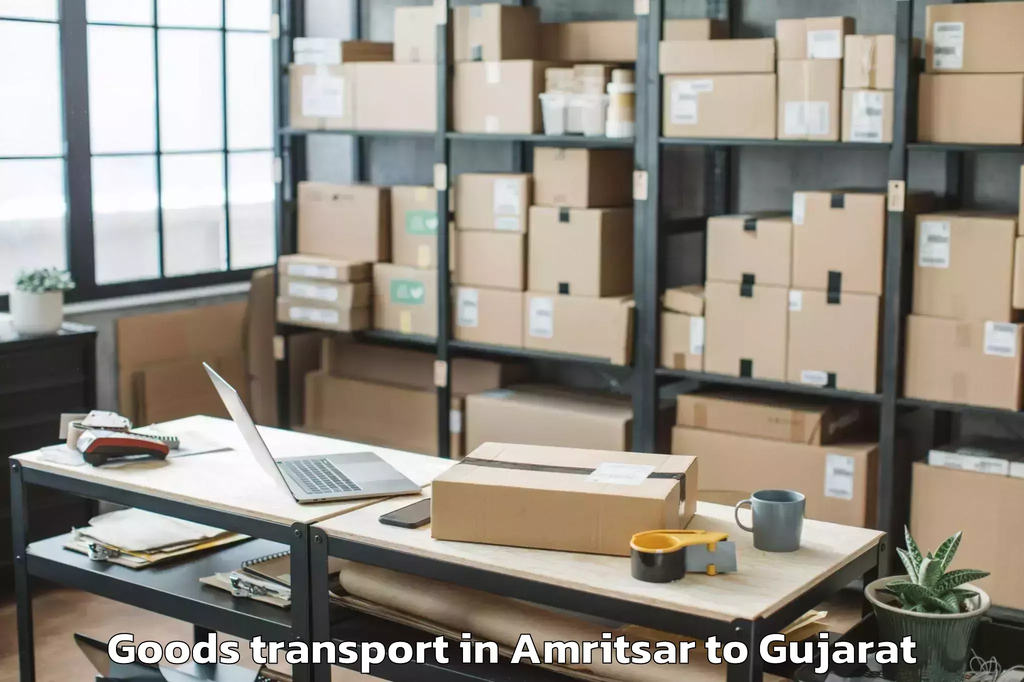 Book Amritsar to Delvada Goods Transport